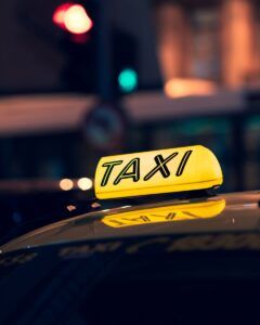 yellow taxi cab on road during night time