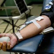 person on chair donating blood