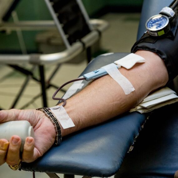 person on chair donating blood