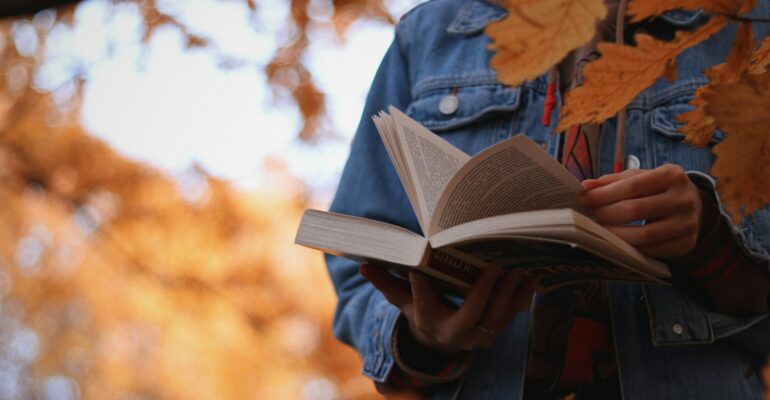 a person holding a book in their hands