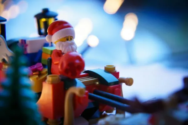 A close up of a toy santa clause on a toy train